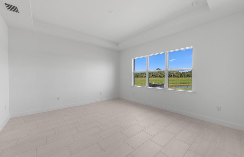 Owner's private suite featuring a drop tray ceiling