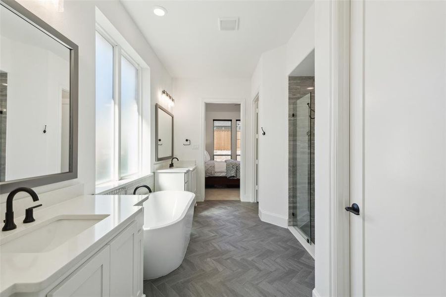 Bathroom with vanity, plus walk in shower, and parquet flooring