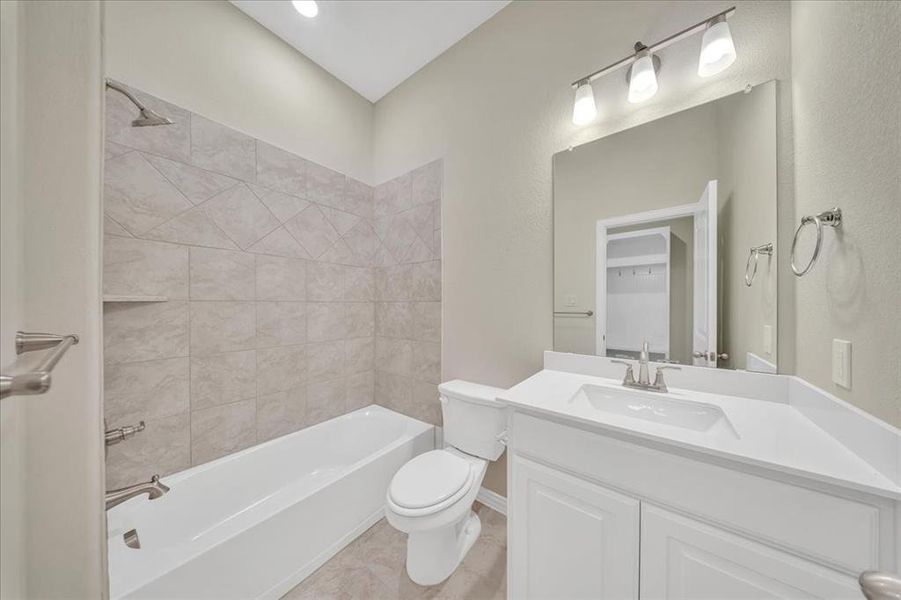 Full bathroom with vanity and bathing tub / shower combination Full bathroom with vanity and bathing tub / shower combination