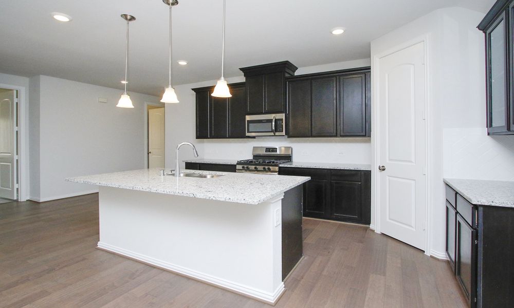 Representative furnished interior of a home built from the Enclave Series - Fiji by DRB Homes in Meyer Ranch – Premier, New Braunfels (Image 15).