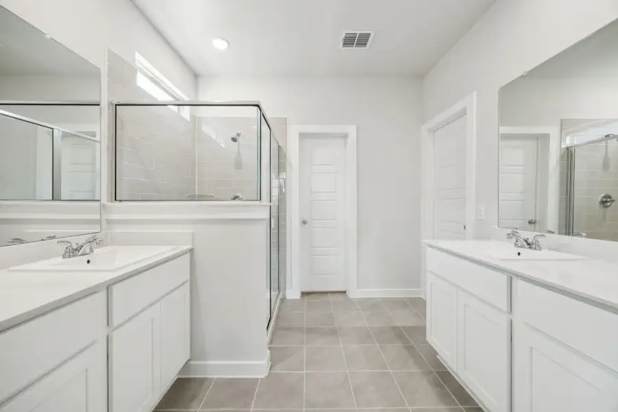 Primary Bathroom in the Masters home plan by Trophy Signature Homes – REPRESENTATIVE PHOTO Primary Bathroom in the Masters home plan by Trophy Signature Homes – REPRESENTATIVE PHOTO