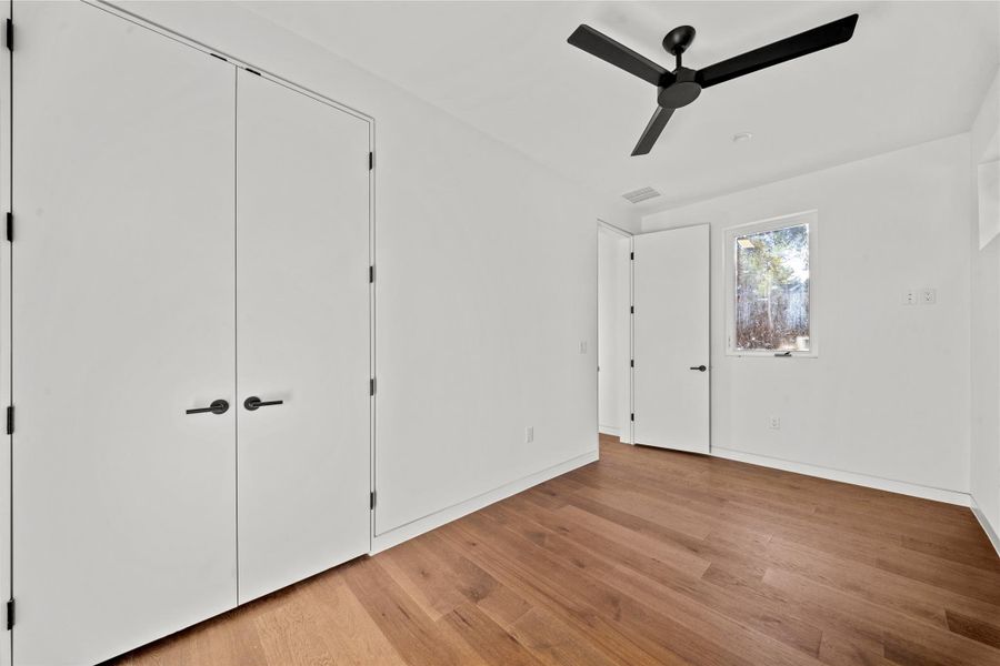 Lower level living room, bedroom 5 and full bath with direct access to the pool.