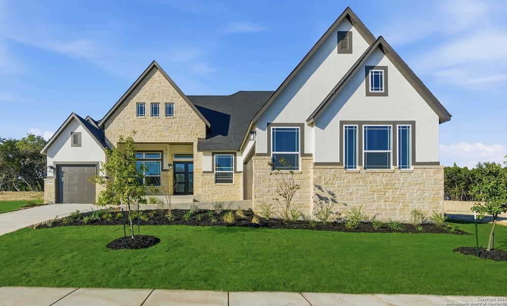 Front exterior of a new home in Caliza Reserve, Boerne, TX, highlighting curb appeal (Image 25).