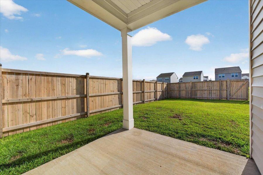 Exterior details and patio area of a home in Pender Woods at Cane Bay, Summerville (Image 26).