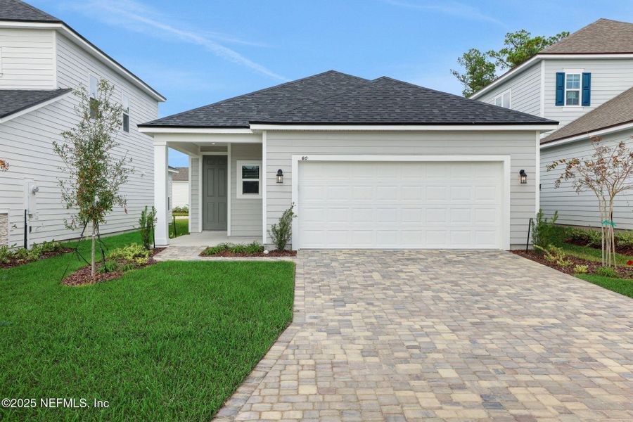 Front exterior of a new home in Brook Forest, St. Augustine, FL, highlighting curb appeal (Image 20).