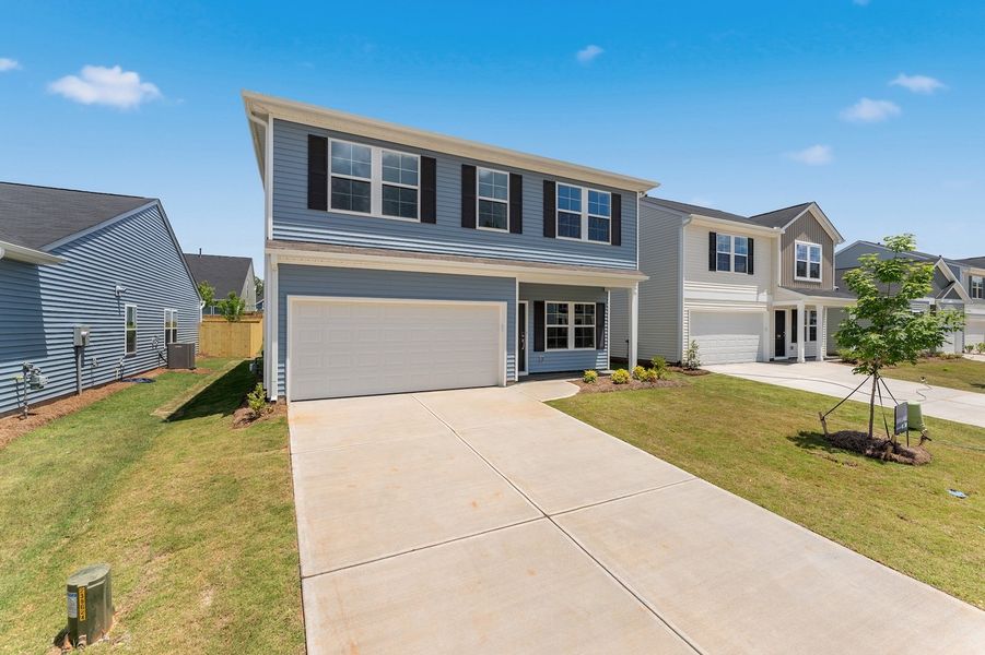 Front exterior of a new home in Braxton Place, Moore, SC, highlighting curb appeal (Image 2). Front exterior of a new home in Braxton Place, Moore, SC, highlighting curb appeal (Image 2).