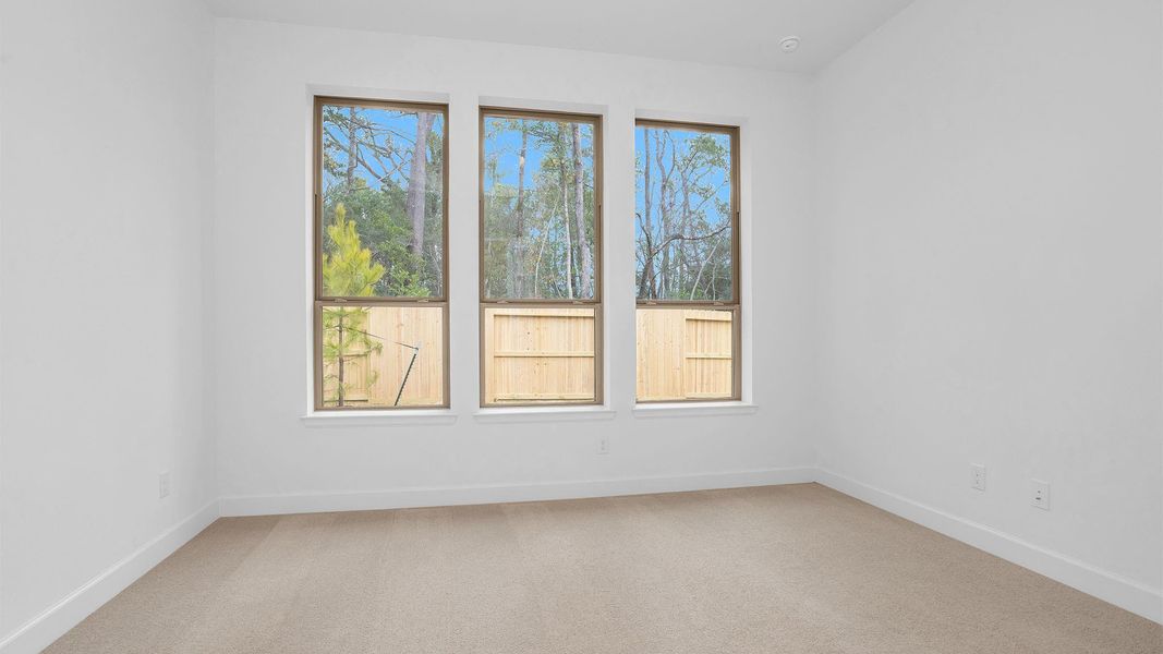 Spacious, unfurnished interior of a new home in The Woodlands Hills 40', Willis (Image 4).