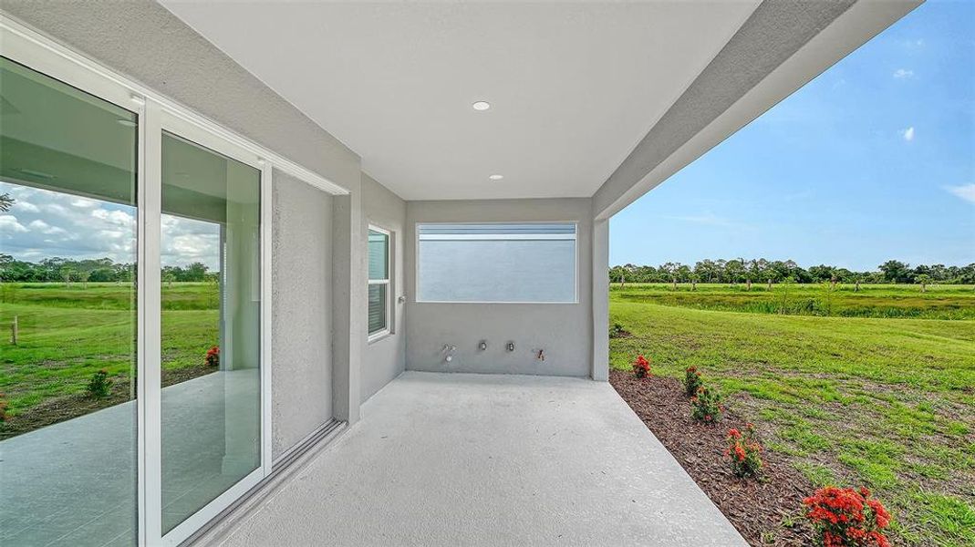 Exterior details and patio area of a home in Grand Park, Sarasota (Image 2).