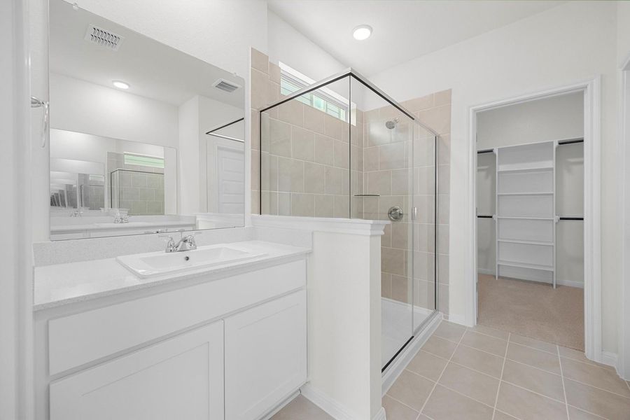 Primary Bath in the Magnolia home plan by Trophy Signature Homes – REPRESENTATIVE PHOTO