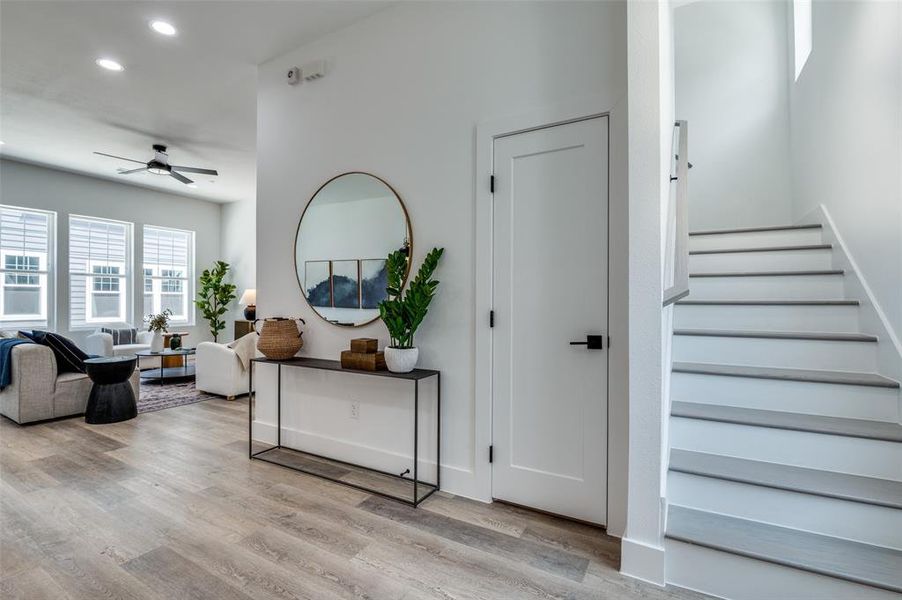 Staircase featuring recessed lighting, ceiling fan, and wood finished floors