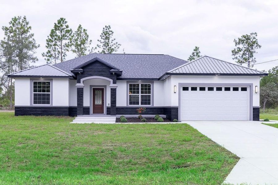 Front exterior of a new home in , Dunnellon, FL, highlighting curb appeal (Image 27). Front exterior of a new home in , Dunnellon, FL, highlighting curb appeal (Image 27).