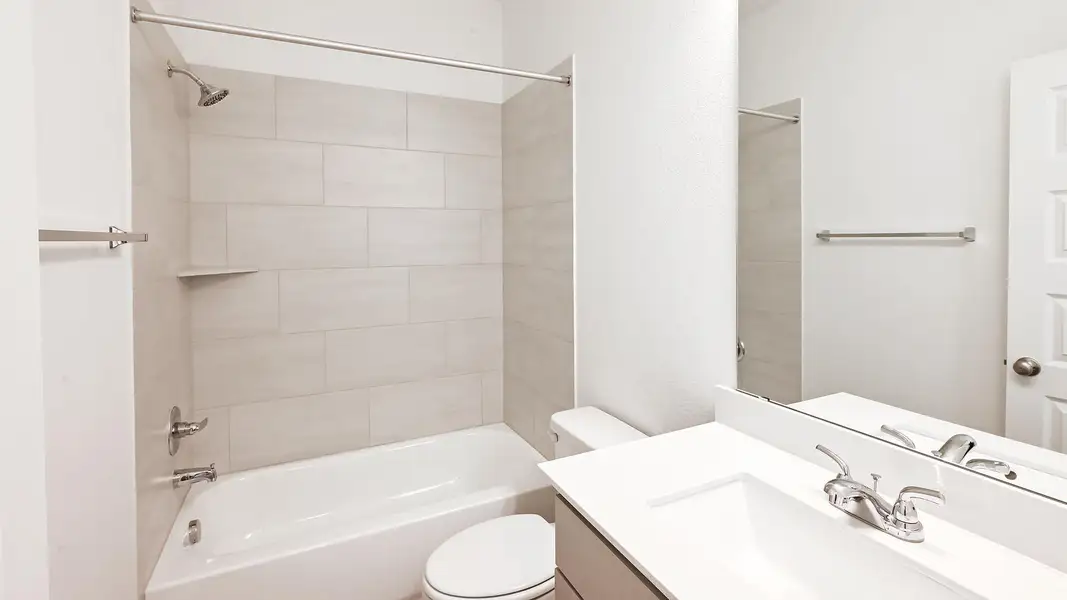 Bathroom featuring shower / bath combination and vanity Bathroom featuring shower / bath combination and vanity