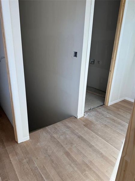 Hallway with light wood finished floors Hallway with light wood finished floors