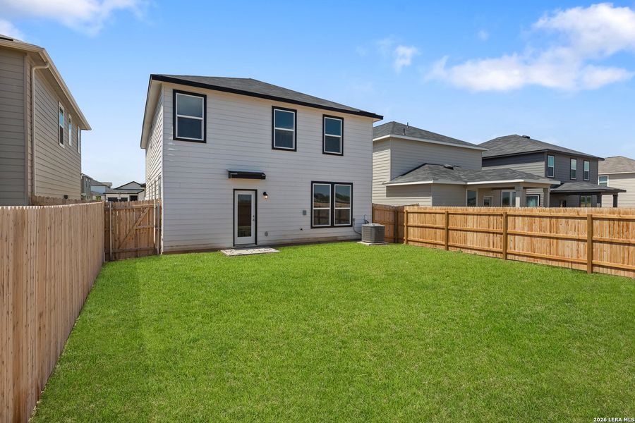 Exterior details and patio area of a home in Medina Crossing, Von Ormy (Image 24).