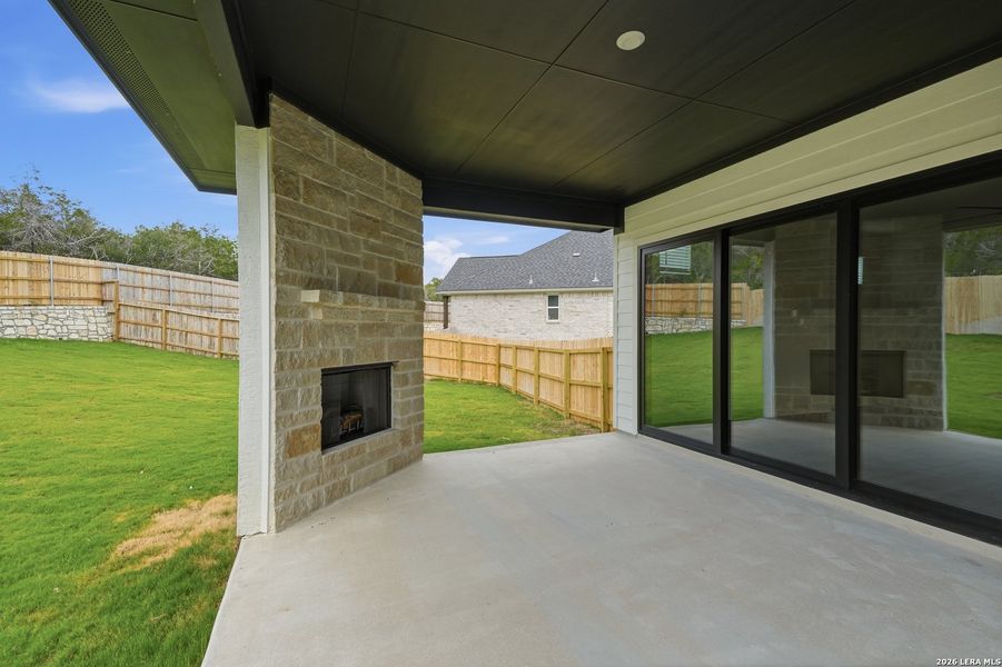 Exterior details and patio area of a home in The Reserve at Potranco Oaks, Castroville (Image 4).