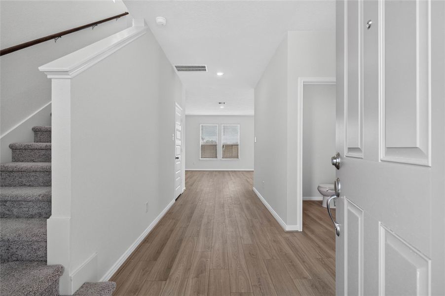 Step into 18310 Hidden Dahlia and experience a bright, airy entryway. The beautiful French Oak vinyl plank flooring brings an instant sense of warmth to the space. Step into 18310 Hidden Dahlia and experience a bright, airy entryway. The beautiful French Oak vinyl plank flooring brings an instant sense of warmth to the space.