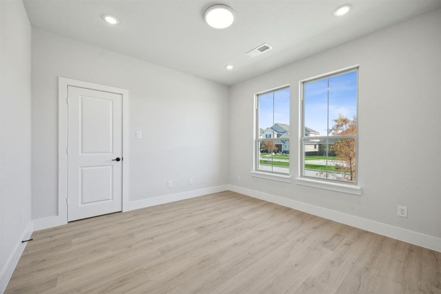 Empty room featuring light hardwood / wood-style floors