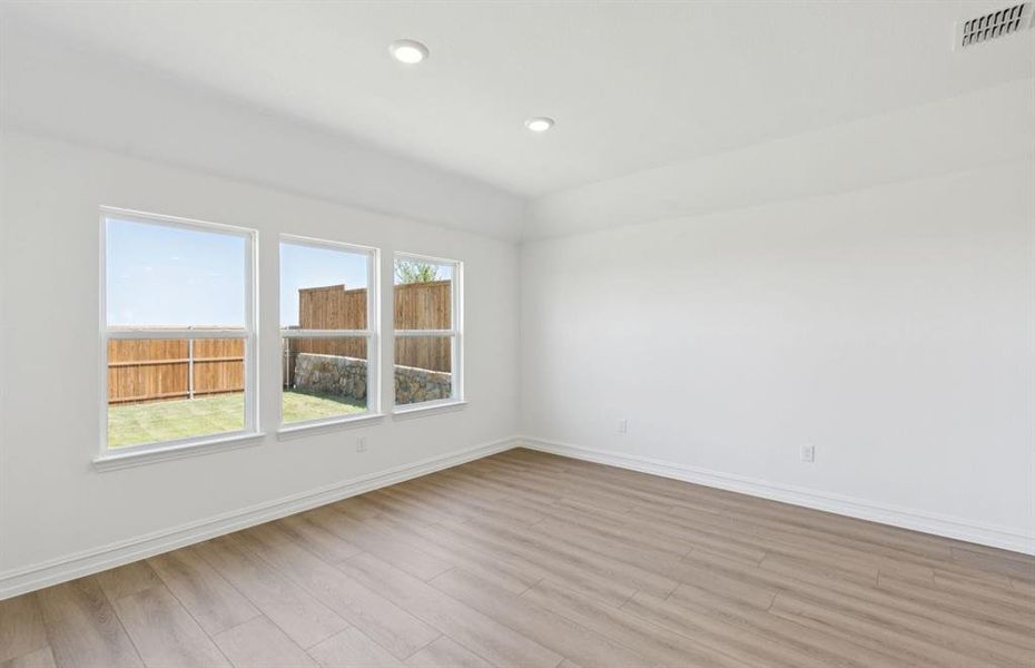 Breakfast area off kitchen with large windows Breakfast area off kitchen with large windows