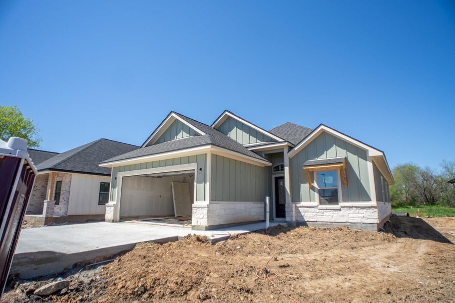 Front exterior of a new home in , Navasota, TX, highlighting curb appeal (Image 2). Front exterior of a new home in , Navasota, TX, highlighting curb appeal (Image 2).