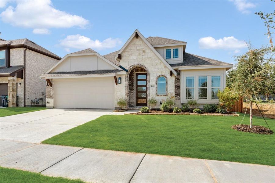 Front exterior of a new home in Glenwood Meadows, Denton, TX, highlighting curb appeal (Image 26). Front exterior of a new home in Glenwood Meadows, Denton, TX, highlighting curb appeal (Image 26).
