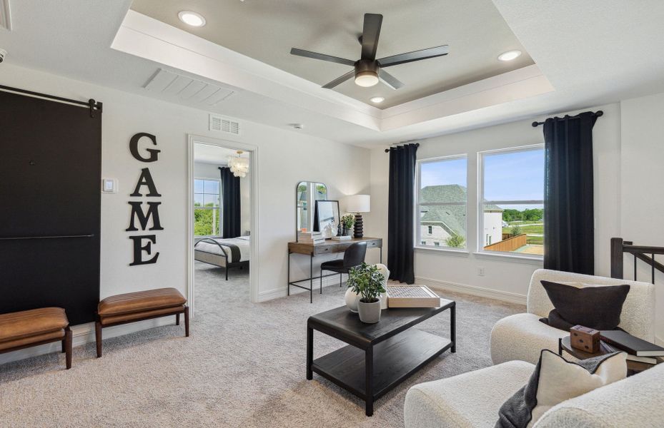 Game room on second floor with tray ceiling