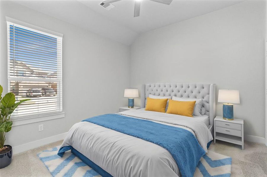 Secondary bedroom features plush carpet, custom paint, high ceilings, ceiling fan, and a large window with privacy blinds.