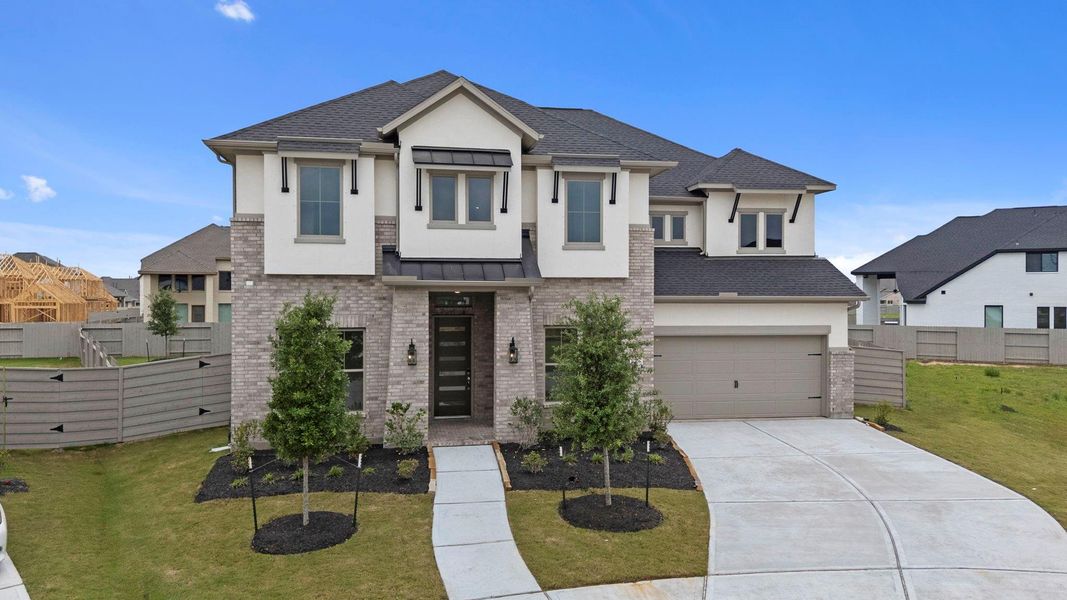 Front exterior of a new home in Pomona, Manvel, TX, highlighting curb appeal (Image 22). Front exterior of a new home in Pomona, Manvel, TX, highlighting curb appeal (Image 22).