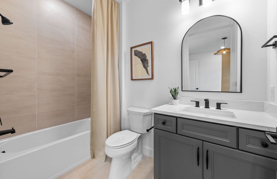Representative furnished interior of a home built from the Renown by DiVosta in BeachWalk by Manasota Key, Englewood (Image 14).