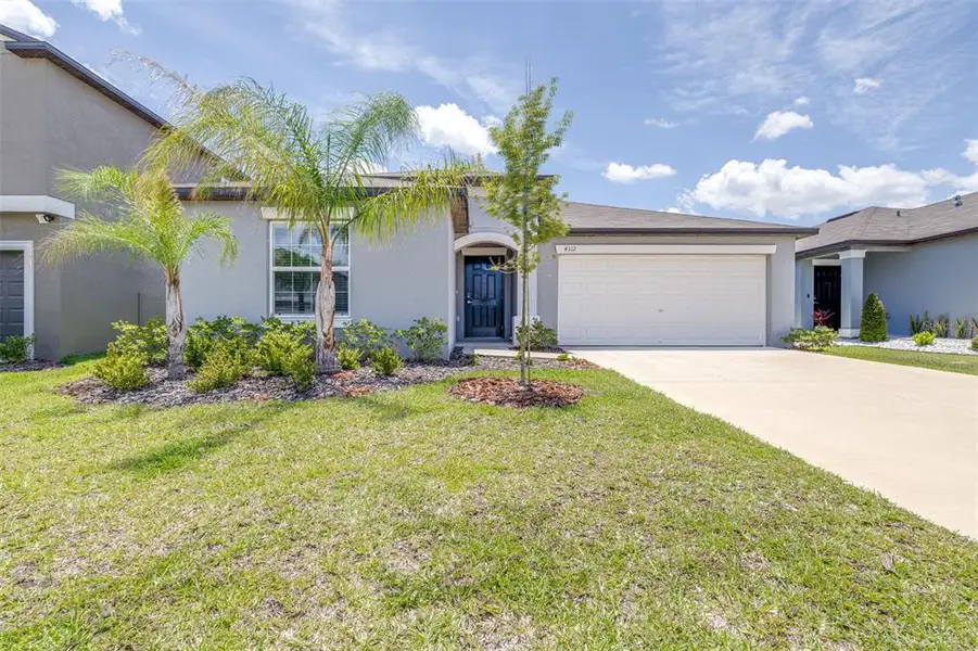 Front exterior of a new home in Wind Meadows South, Bartow, FL, highlighting curb appeal (Image 1). Front exterior of a new home in Wind Meadows South, Bartow, FL, highlighting curb appeal (Image 1).