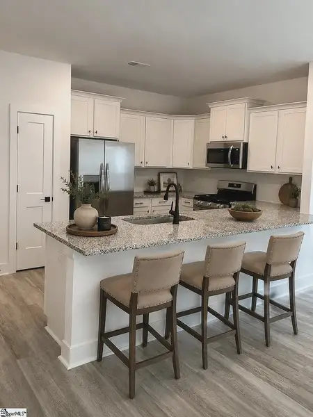 Furnished interior view inside a new home in Parkstone Place Townhomes, Roebuck (Image 6).