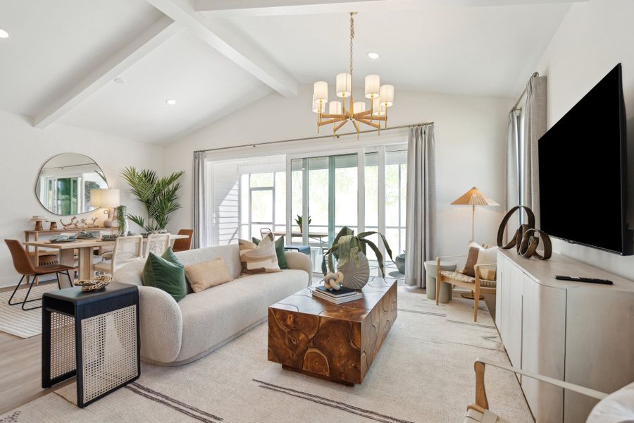 Great room with painted ceiling beams