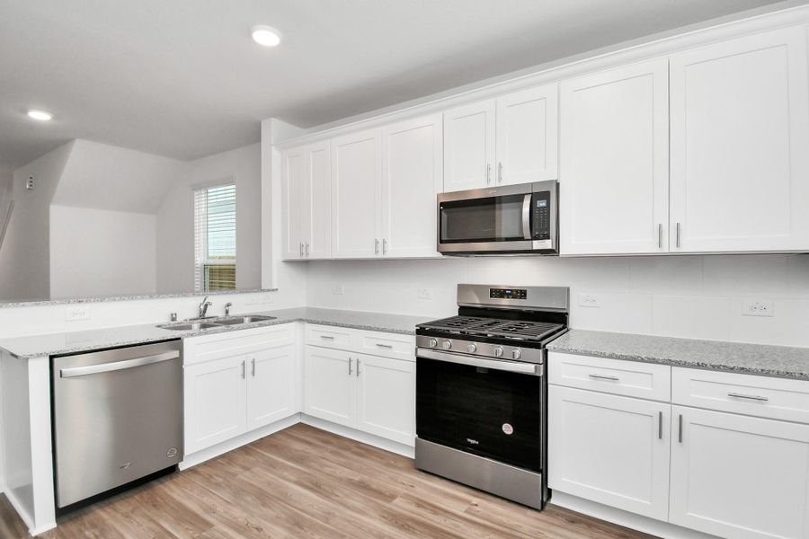 Furnished interior view inside a new home in Decker Farms, Magnolia (Image 6).
