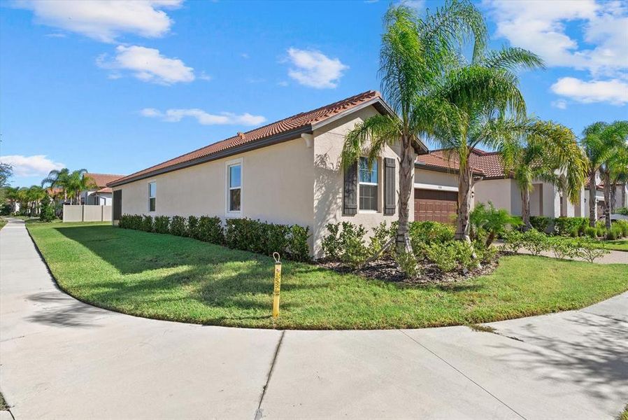 Front exterior of a new home in Southshore Bay Active Adult: Active Adult Manors, Wimauma, FL, highlighting curb appeal (Image 23).