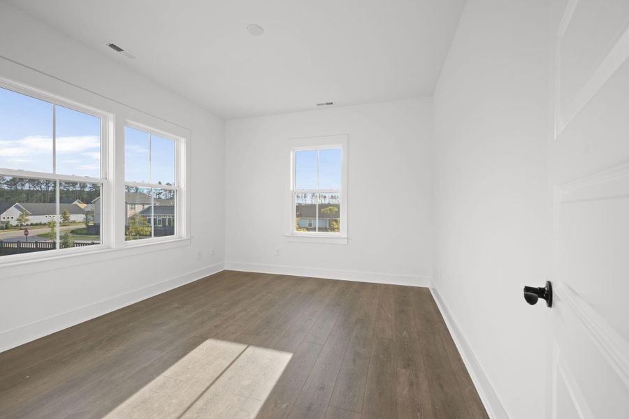 Spacious, unfurnished interior of a new home in The Domus Collection at Midtown Nexton, Summerville (Image 24).