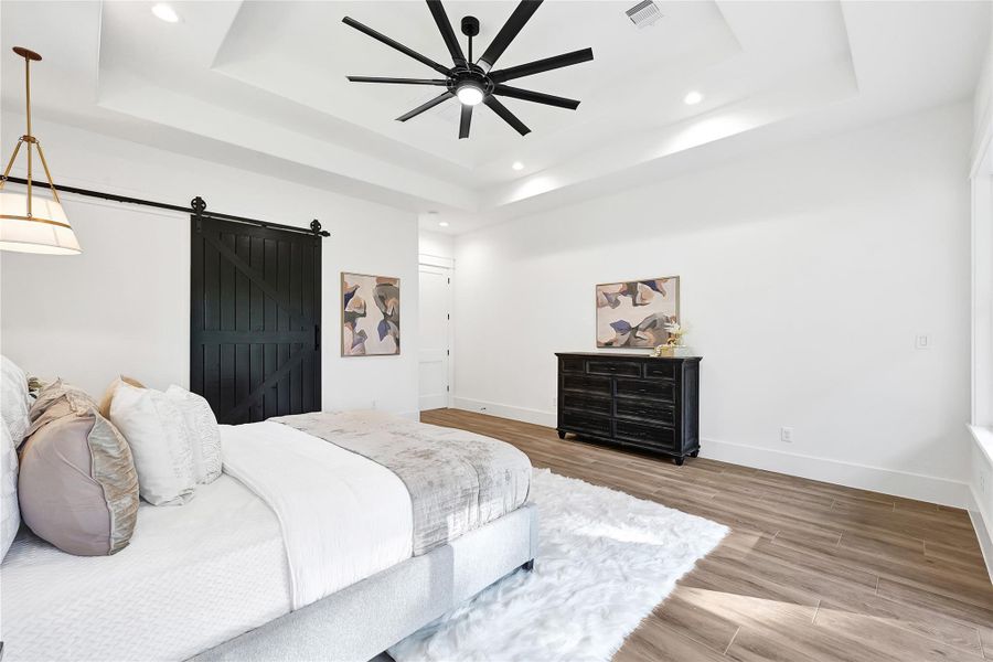 Custom barn door to primary bathroom
