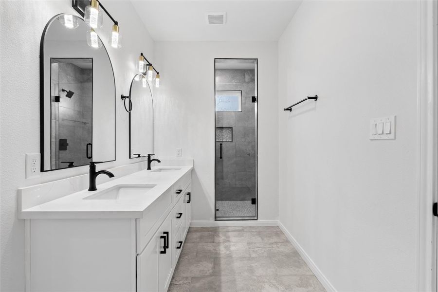 Sleek ensuite with modern finishes and a streamlined design for a spa-like touch.