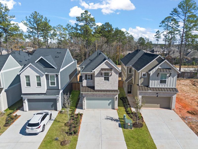 Front exterior of a new home in The Woodlands Hills, Willis, TX, highlighting curb appeal (Image 18). Front exterior of a new home in The Woodlands Hills, Willis, TX, highlighting curb appeal (Image 18).