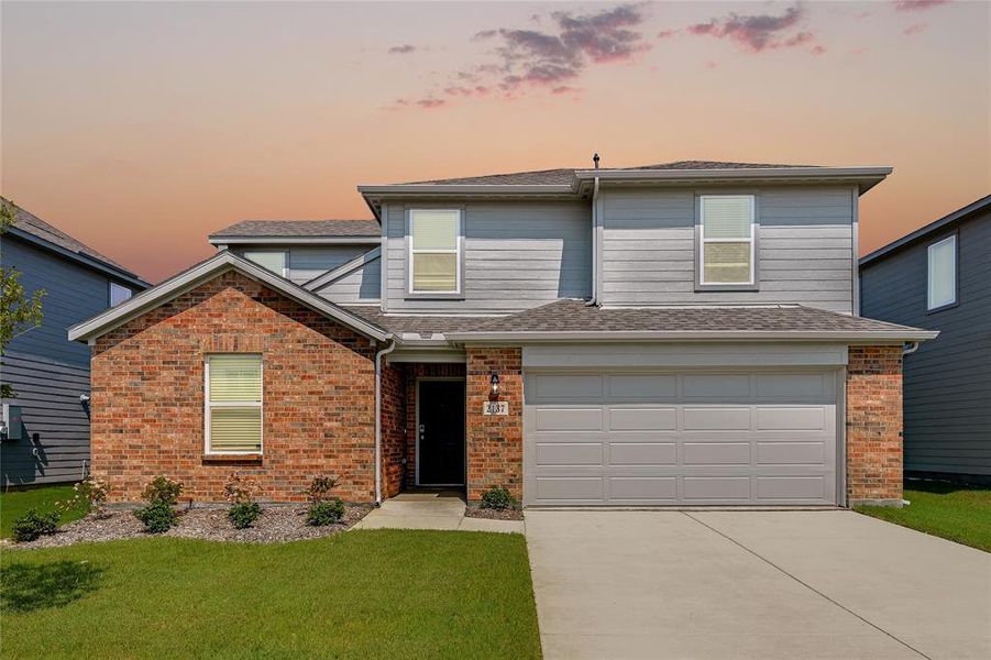 Front exterior of a new home in River Ridge, Crandall, TX, highlighting curb appeal (Image 1). Front exterior of a new home in River Ridge, Crandall, TX, highlighting curb appeal (Image 1).