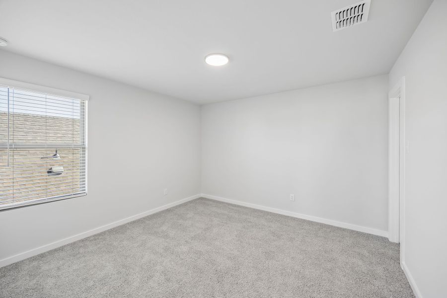 Bedroom in the Mesquite home plan by Trophy Signature Homes – REPRESENTATIVE PHOTO