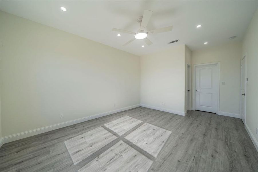 Spare room with recessed lighting, light wood-style floors, and ceiling fan Spare room with recessed lighting, light wood-style floors, and ceiling fan