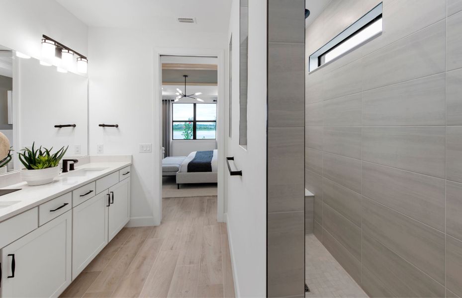 Owner's bathroom with double sink vanity & walk in shower