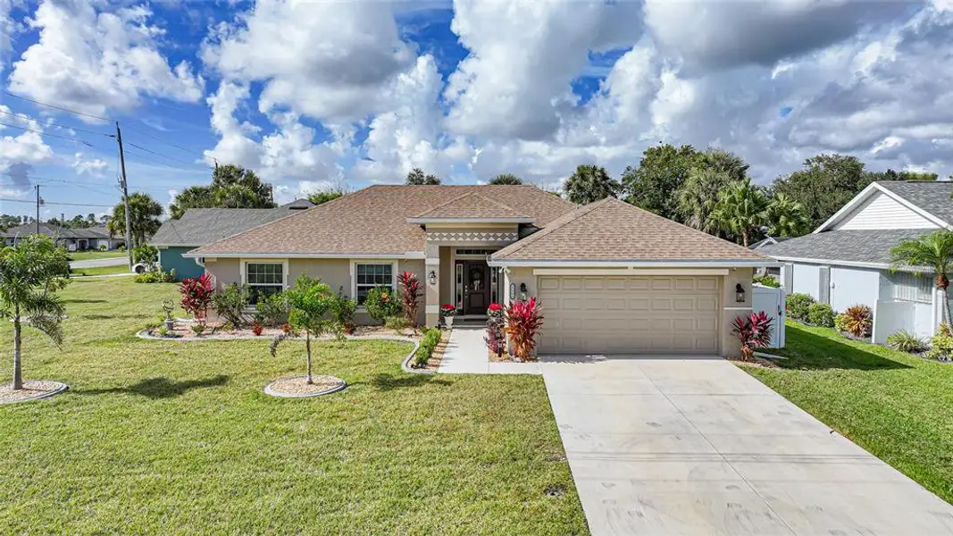 Front exterior of a new home in , Punta Gorda, FL, highlighting curb appeal (Image 1). Front exterior of a new home in , Punta Gorda, FL, highlighting curb appeal (Image 1).