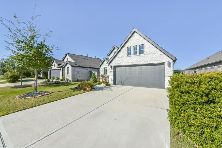 Front exterior of a new home in , Katy, TX, highlighting curb appeal (Image 1). Front exterior of a new home in , Katy, TX, highlighting curb appeal (Image 1).