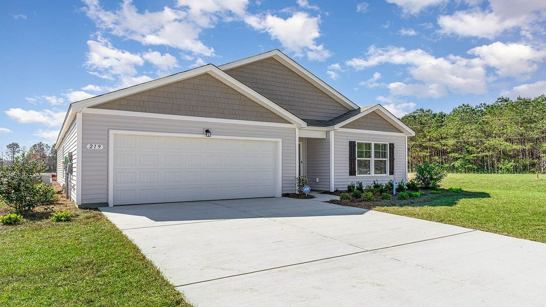 Front exterior of a new home in The Bluffs at Mill Creek, Florence, SC, highlighting curb appeal (Image 2). Front exterior of a new home in The Bluffs at Mill Creek, Florence, SC, highlighting curb appeal (Image 2).