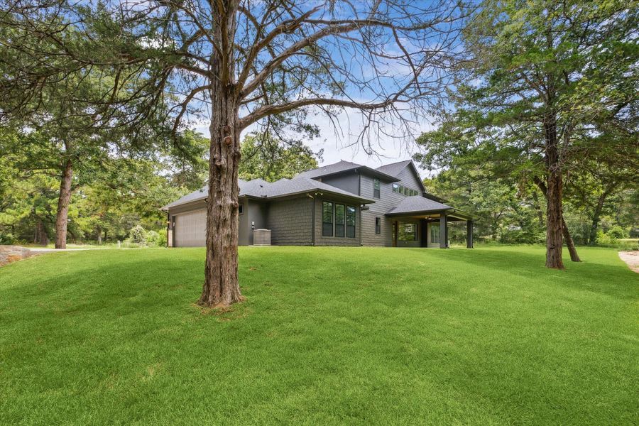 Front exterior of a new home in , New Ulm, TX, highlighting curb appeal (Image 23). Front exterior of a new home in , New Ulm, TX, highlighting curb appeal (Image 23).