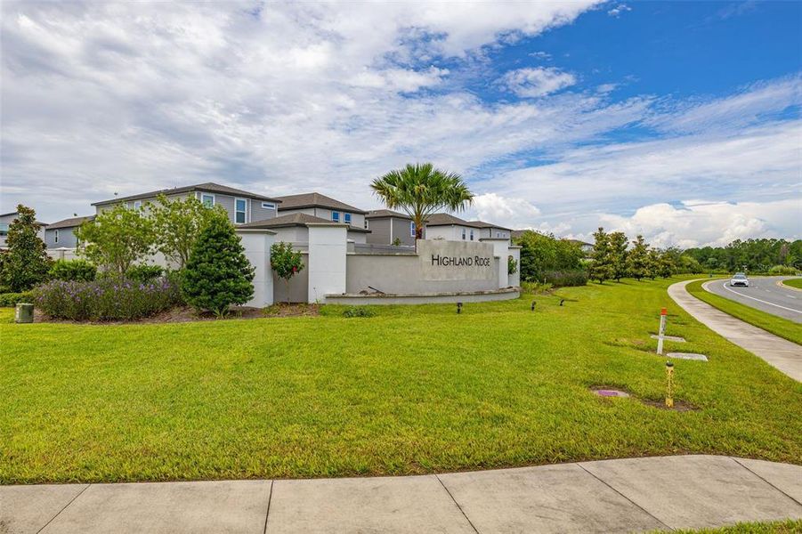 Front exterior of a new home in Highland Ridge, Winter Garden, FL, highlighting curb appeal (Image 21).