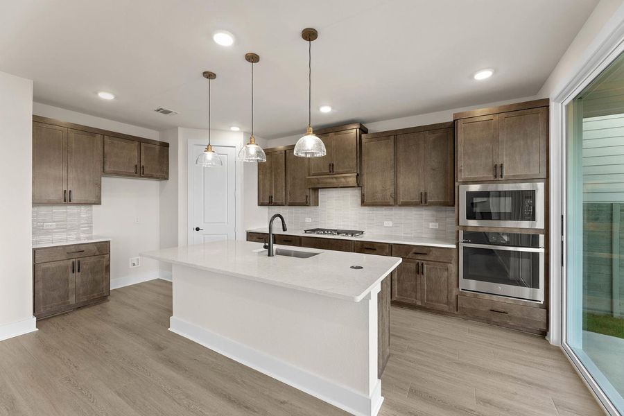 Furnished interior view inside a new home in Cottage Collection at Harvest, Argyle (Image 6).