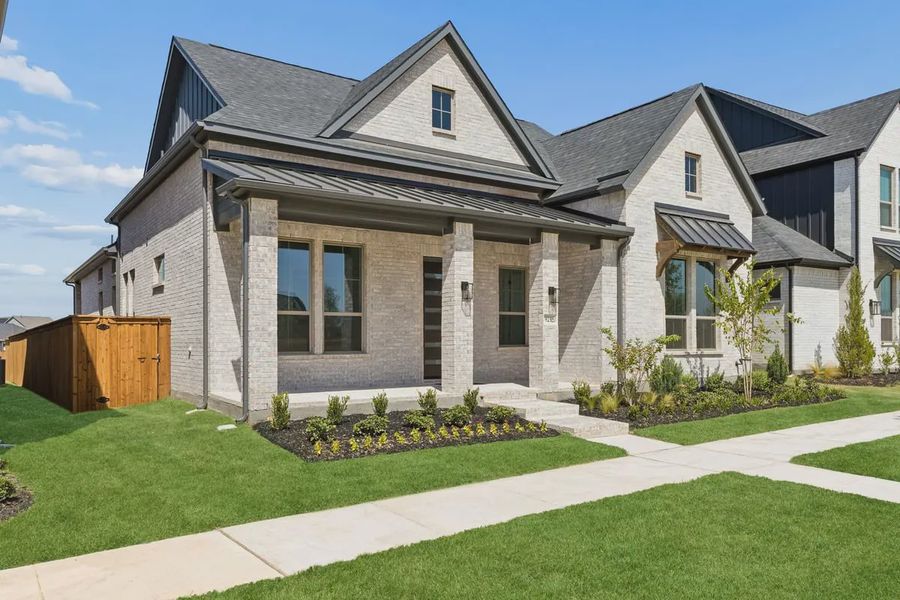 Front exterior of a new home in The Grove Frisco 50's, Frisco, TX, highlighting curb appeal (Image 2). Front exterior of a new home in The Grove Frisco 50's, Frisco, TX, highlighting curb appeal (Image 2).