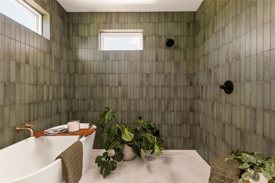 Full bathroom featuring tiled shower and a freestanding bath