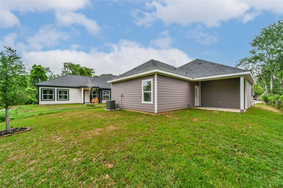 Front exterior of a new home in , Conroe, TX, highlighting curb appeal (Image 23).